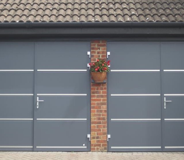Two Ryterna insulated made to measure side-hinged garage doors Horisontal rib with steel appliques, 50/50 split